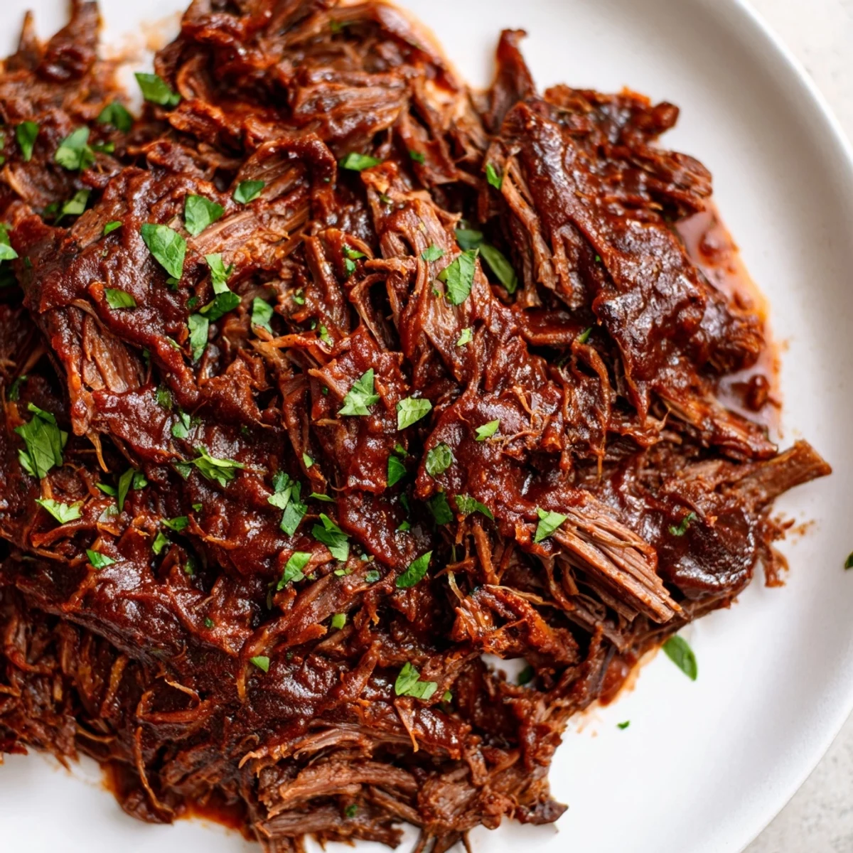 Savory Slow Cooker Beef Brisket with BBQ Sauce, sliced and glazed, perfect for a hearty family dinner or picnic.