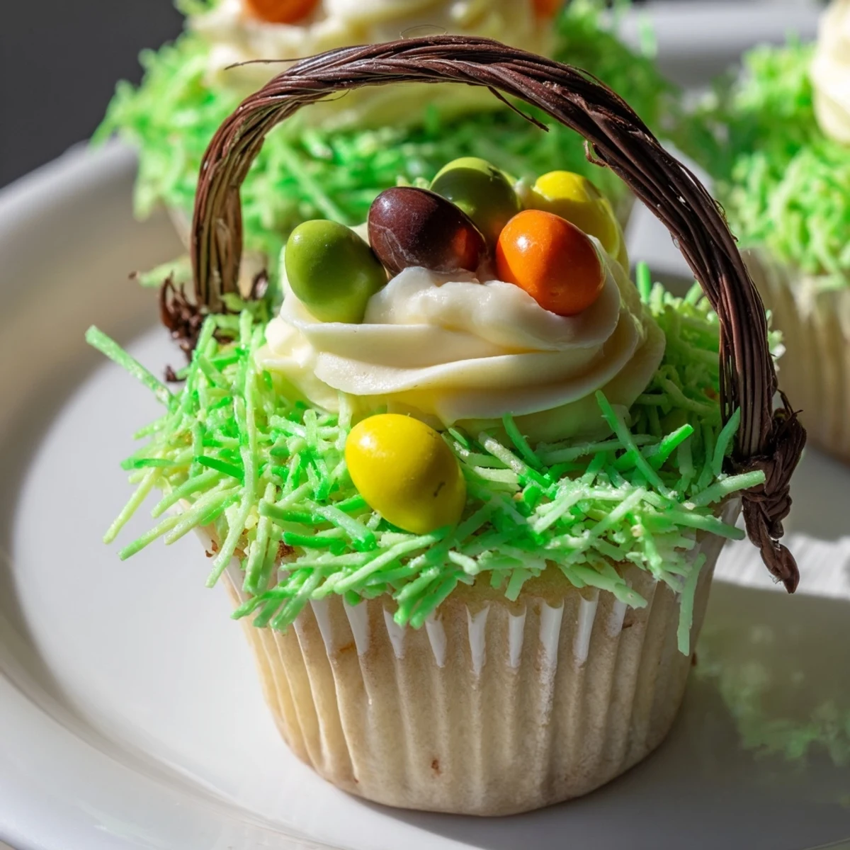 A platter of Easter Basket Cupcakes shows licorice handles and bright green coconut, perfect for a holiday dessert spread.