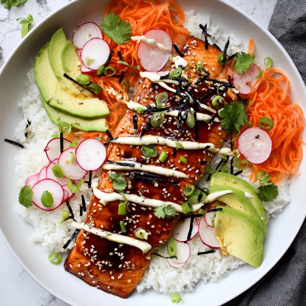 A close-up shows tender salmon glazed with teriyaki sauce, mixed with crunchy pickled vegetables in a beautiful Teriyaki Salmon Rice Taco Bowl.