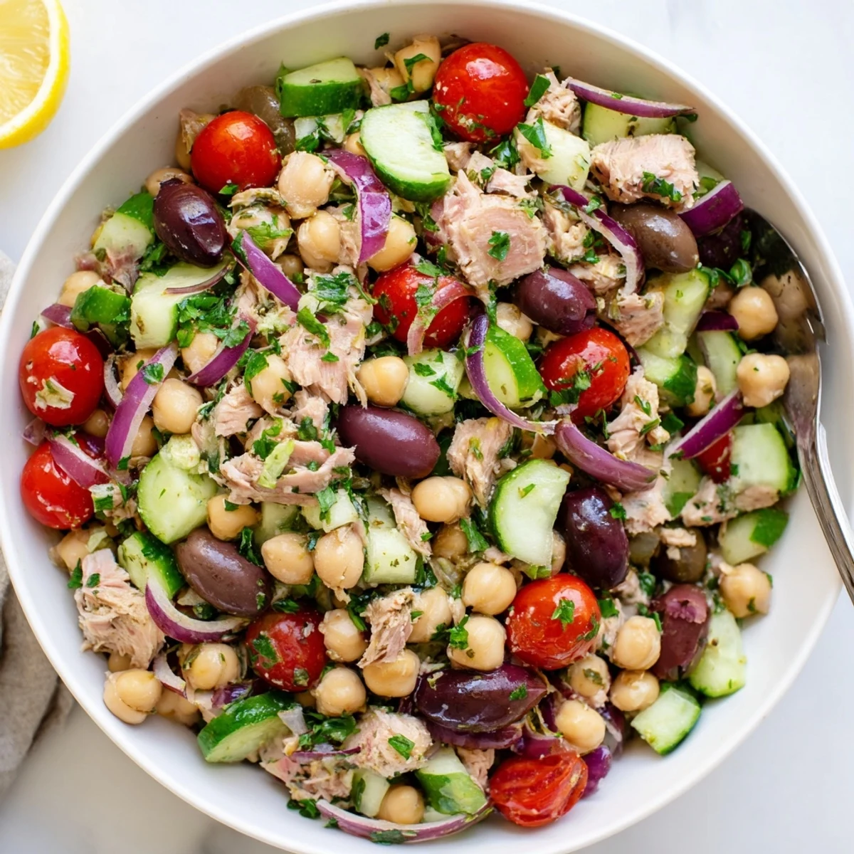 Protein-packed Mediterranean tuna salad with chickpeas crisp vegetables and bright lemon-herb vinaigrette