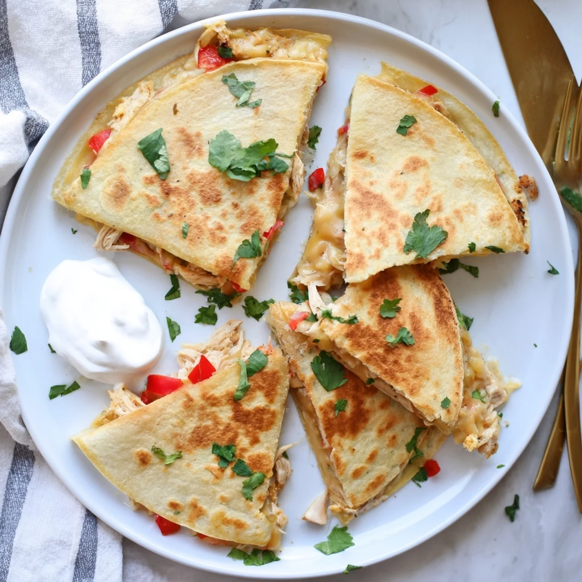 Half-moon shaped quesadillas pan-fried to golden perfection with seasoned shredded chicken and veggies