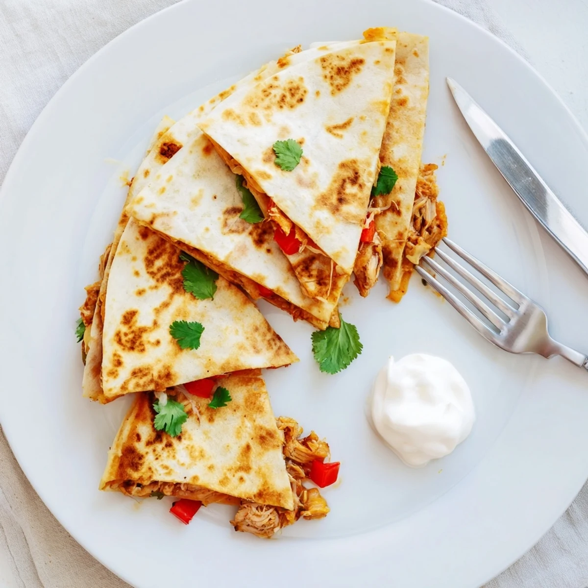 Sizzling skillet quesadillas with crunchy tortillas oozing melted Monterey Jack and spiced chicken