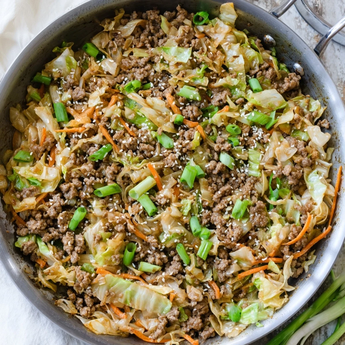 One skillet keto egg roll in a bowl featuring tender vegetables seasoned pork and green onions