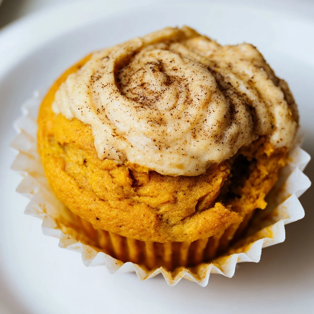 Warm chai pumpkin cheesecake muffins fresh from the oven on a wire rack