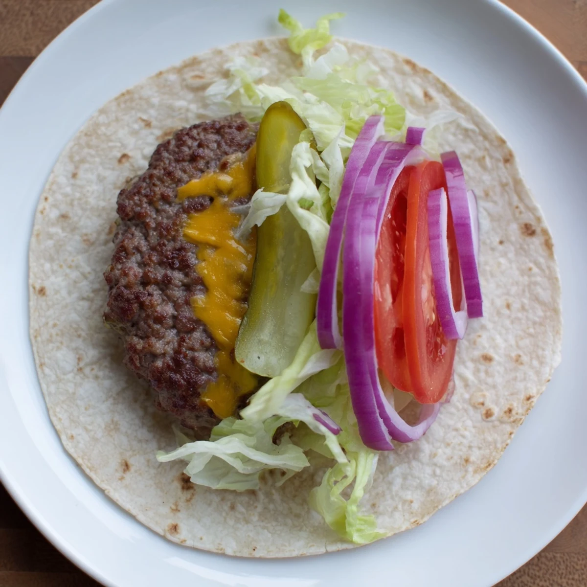 Smash Burger Tacos Recipe showcasing crispy browned beef, melty cheddar, fresh toppings.