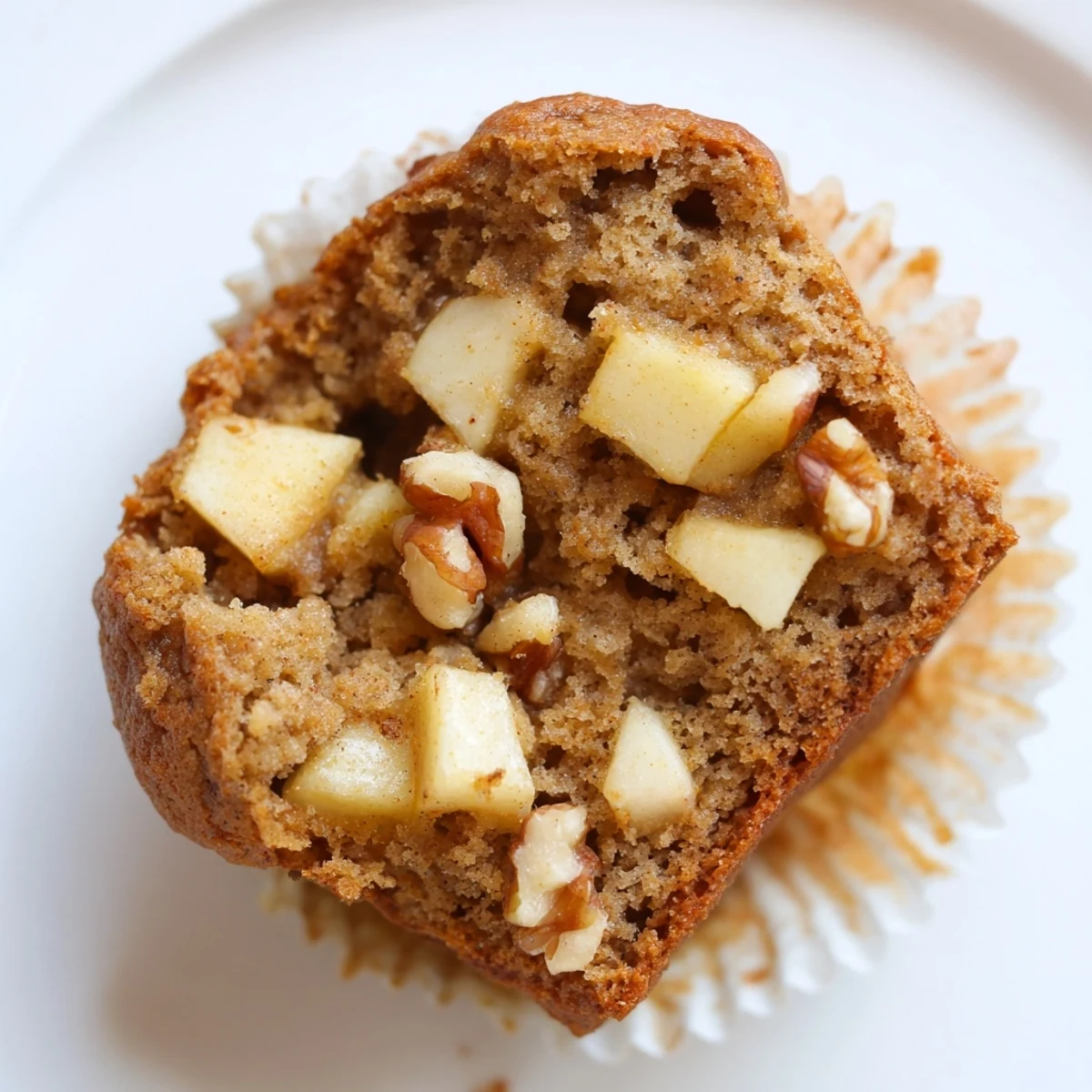 Sliced Healthy Apple Cinnamon Greek Yogurt Muffins with melting butter, warm spices