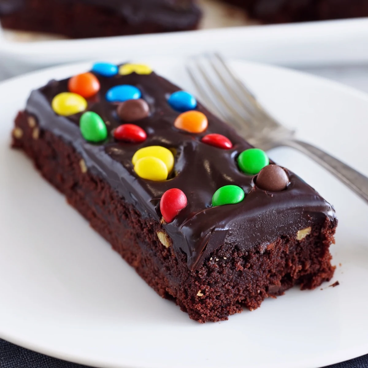 Gourmet Cosmic Brownies Bars topped with glossy chocolate ganache and rainbow candies