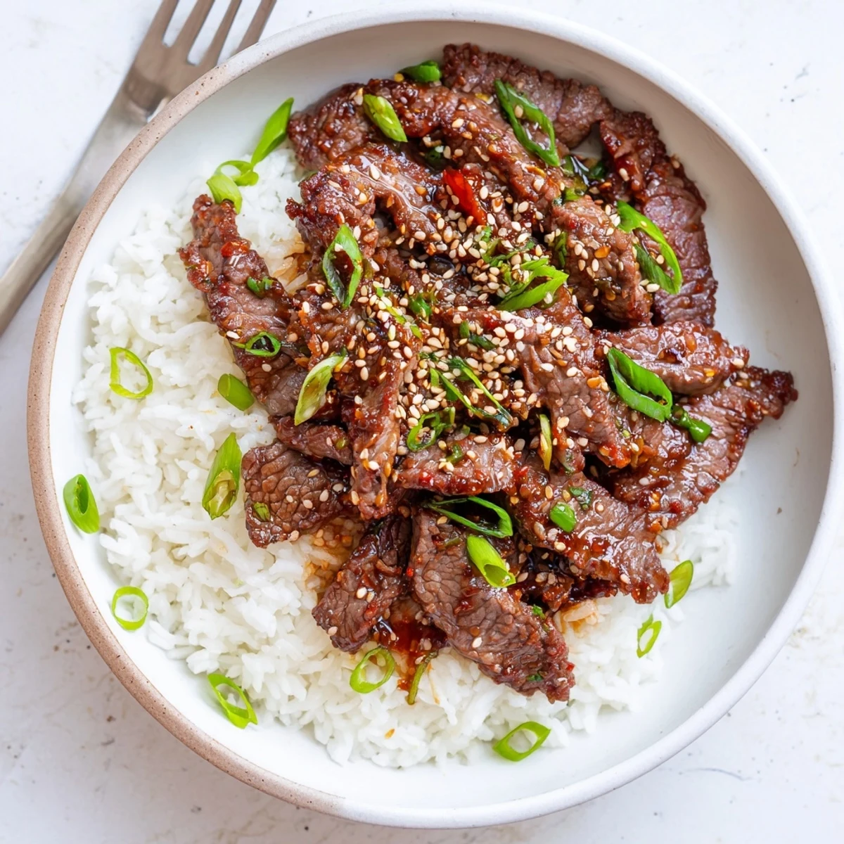 Thinly sliced Korean Beef tossed with green onions and sesame seeds  